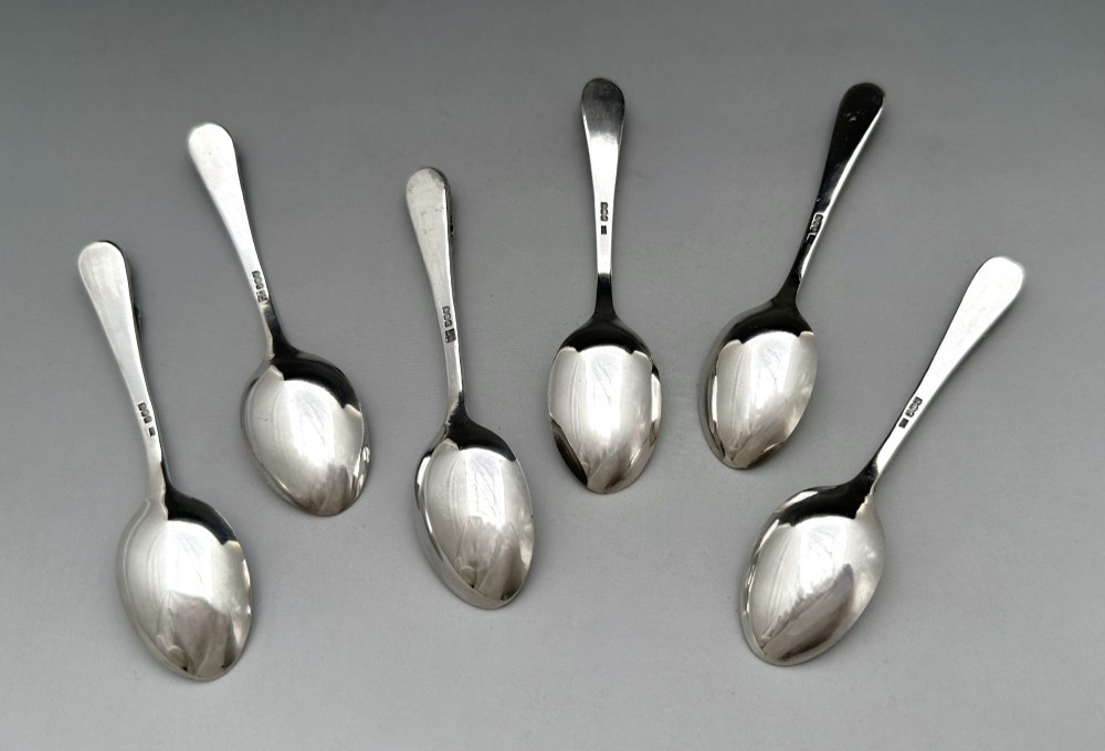 A boxed set of six Scottish sterling silver demi-tasse spoons set with varied semi-precious cabochon stones in a blue fitted case. View VII
