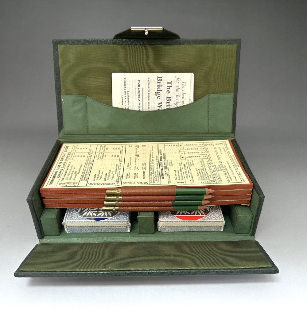 A dark green pebbled leather rectangular bridge box featuring applied silver script spelling Bridge on the top cover and a silver clasp closure. View V