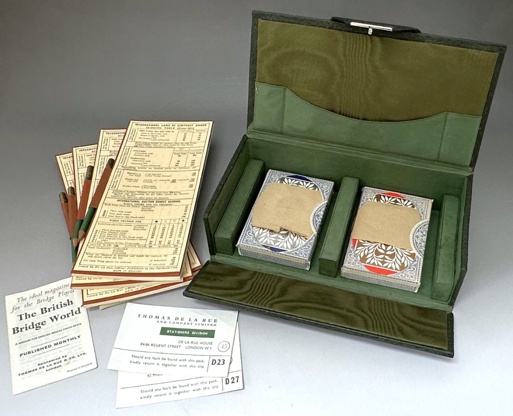 A dark green pebbled leather rectangular bridge box featuring applied silver script spelling Bridge on the top cover and a silver clasp closure. View VII