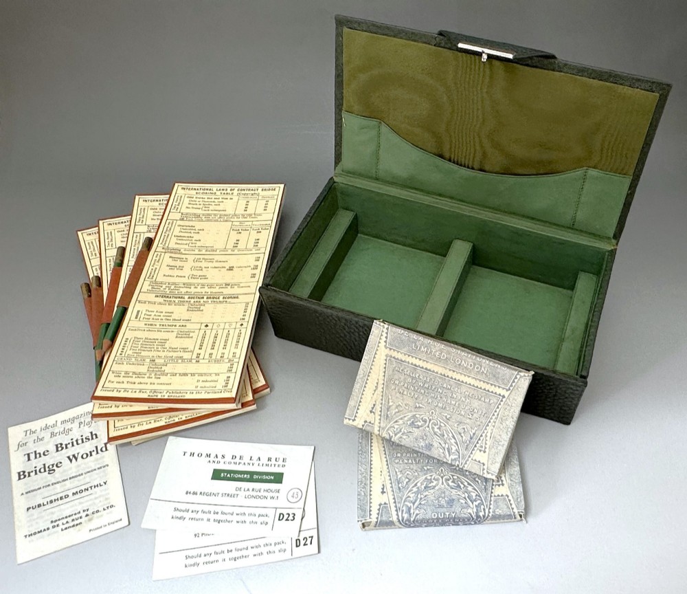 A dark green pebbled leather rectangular bridge box featuring applied silver script spelling Bridge on the top cover and a silver clasp closure. View VIII