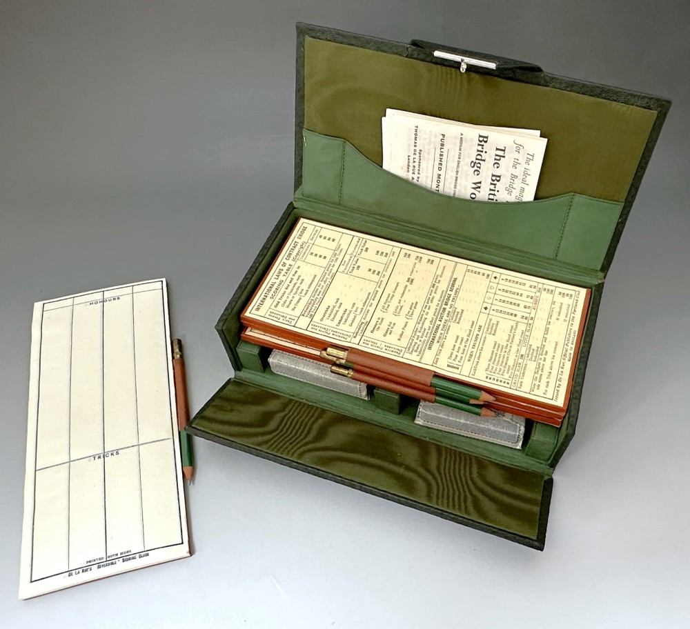 A dark green pebbled leather rectangular bridge box featuring applied silver script spelling Bridge on the top cover and a silver clasp closure. View IX
