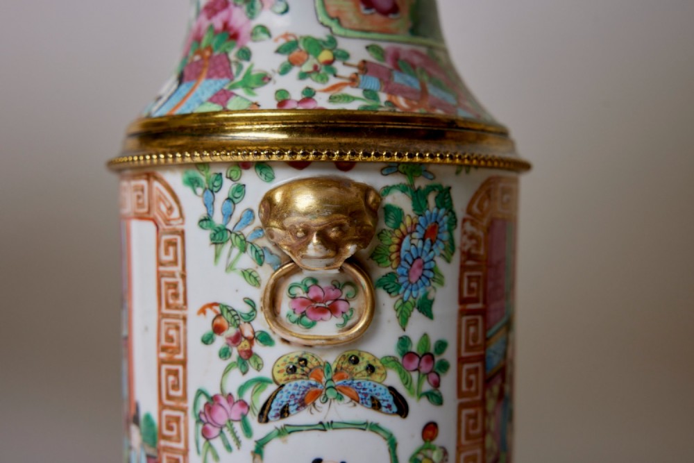 A pair of Chinese porcelain vase table lamps with hand-painted figures, gilt metal mounts, and cream pleated fabric shades. View IV