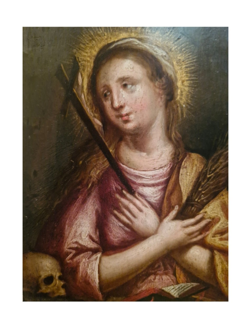 A small Flemish style religious oil painting depicting a female saint holding a cross and palm frond, housed in a thick ebonised wood frame with a gold sight edge. View III