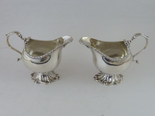 1897 HALLMARKED PAIR HELMET SHAPE SILVER SAUCE BOAT CREAM JUG - ADDITIONAL PHOTO 1