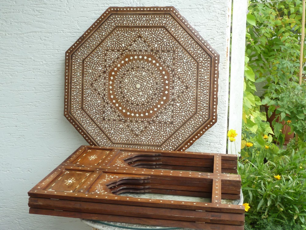 An Anglo-Indian octagonal wooden table featuring intricate bone inlay with geometric and floral motifs above Moorish arched lower aprons. View IV