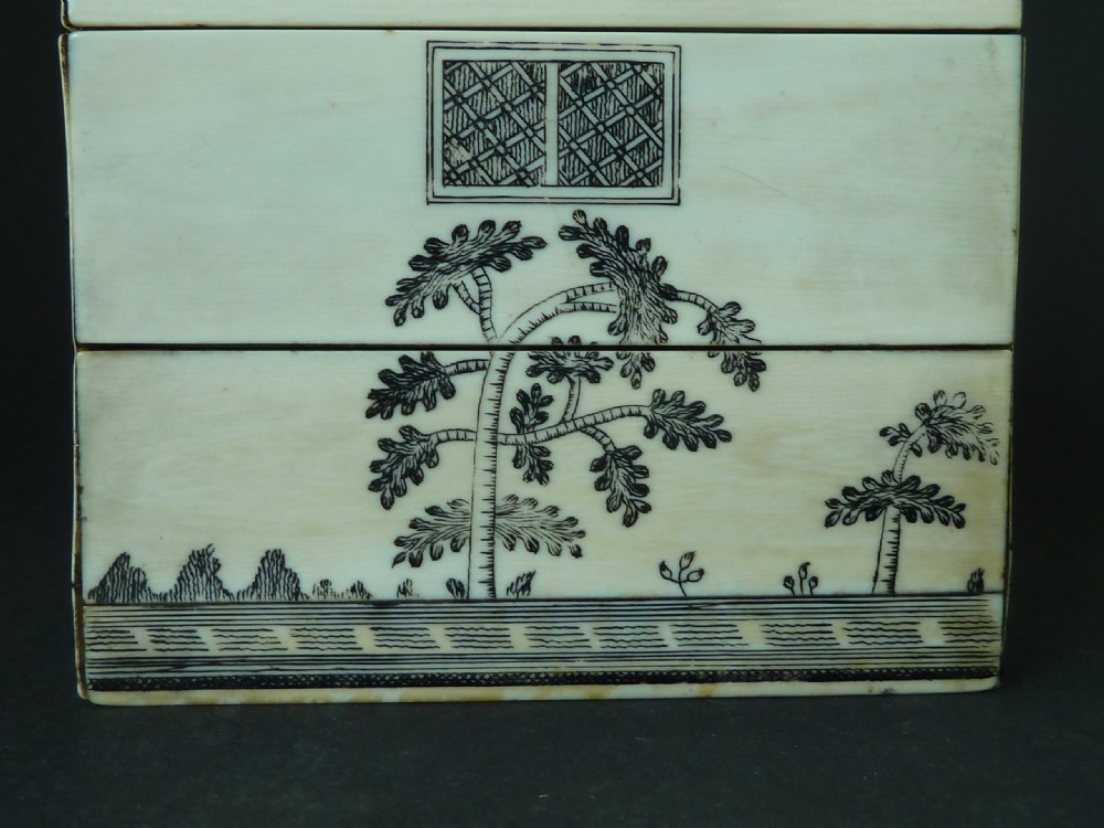 A house-shaped antique Anglo-Indian sewing box clad in ivory panels with black lac-engraved architectural details, trees, and a pitched roof. View IV