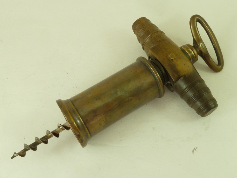 A Georgian patinated bronze Thomason patent mechanical corkscrew featuring a Royal Coat of Arms crest badge and steel helix. View II