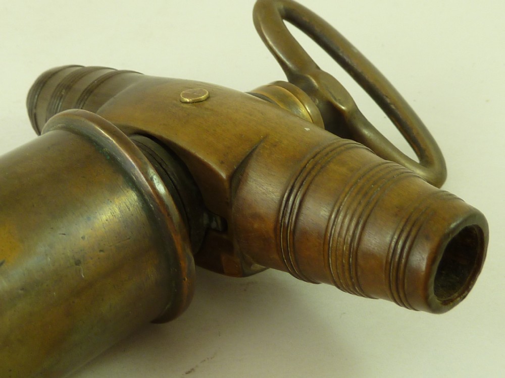 A Georgian patinated bronze Thomason patent mechanical corkscrew featuring a Royal Coat of Arms crest badge and steel helix. View VII