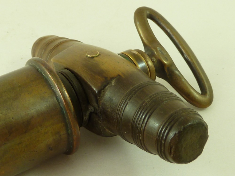 A Georgian patinated bronze Thomason patent mechanical corkscrew featuring a Royal Coat of Arms crest badge and steel helix. View VIII