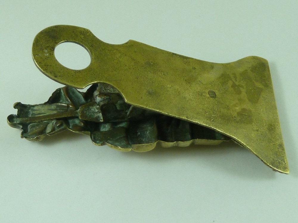 Victorian heavy cast brass letter clip decorated with relief carvings of agricultural tools, wheat sheaves, and barrels. View VI