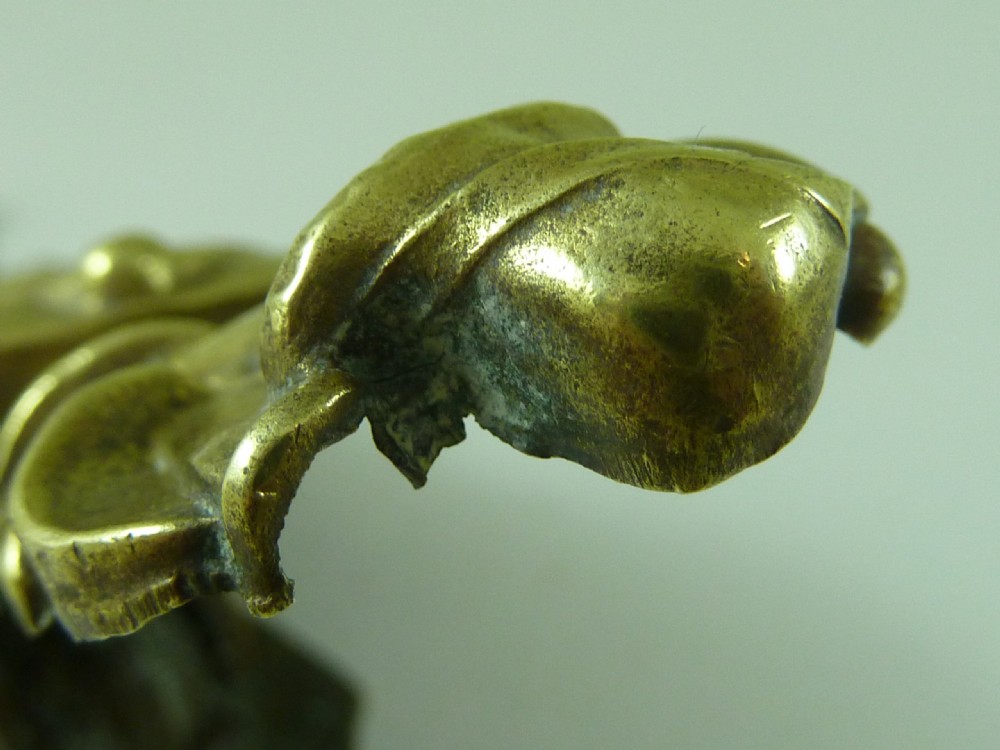Victorian heavy cast brass letter clip decorated with relief carvings of agricultural tools, wheat sheaves, and barrels. View VIII