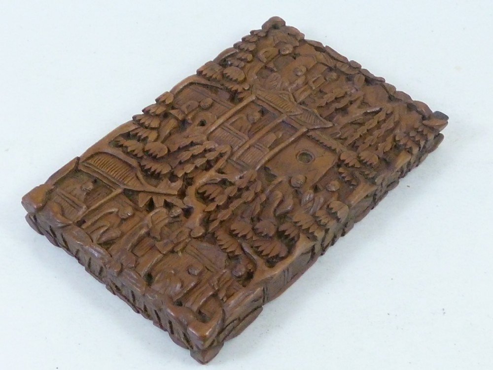 A rectangular nineteenth-century Chinese sandalwood visiting card case featuring high-relief relief carvings of figures, pavilions, and trees. View IV