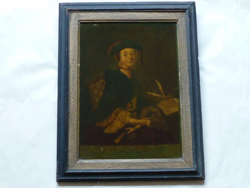 A framed 18th-century reverse glass print depicting a portrait of a seated lady wearing a green cloak and cap next to a desk with a quill. View II