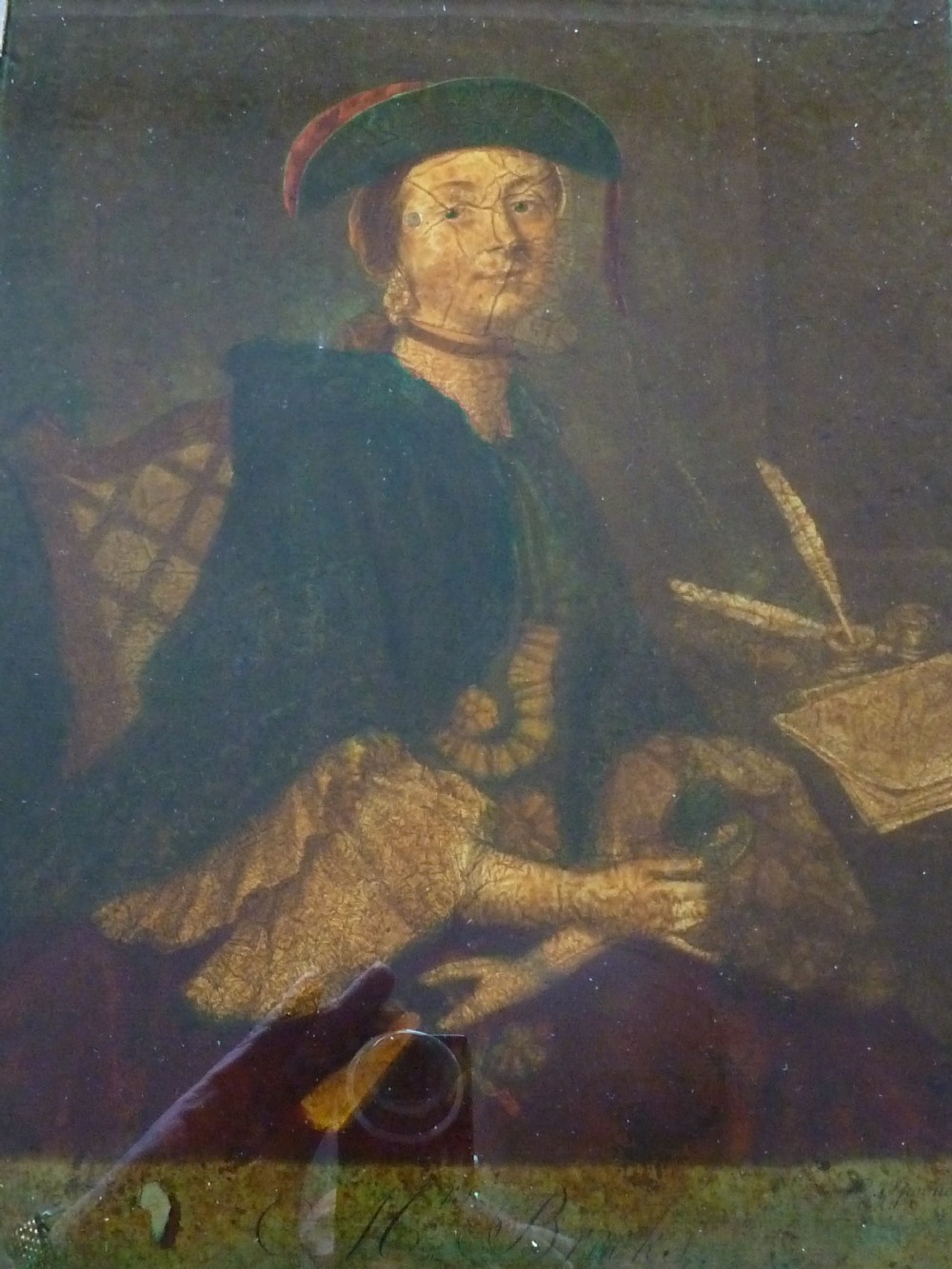 A framed 18th-century reverse glass print depicting a portrait of a seated lady wearing a green cloak and cap next to a desk with a quill. View IV