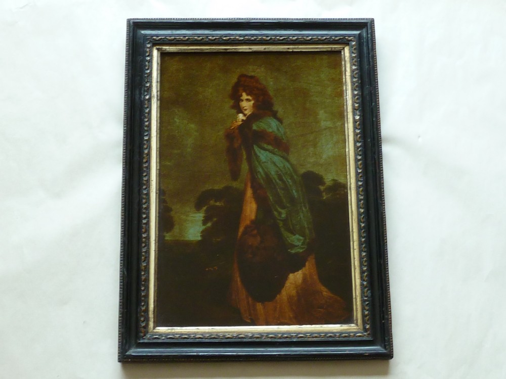 A Georgian reverse glass painted print depicting Elizabeth Farren wearing a green fur-trimmed cloak, set in a dark moulded wooden frame with a gilt inner border. View II