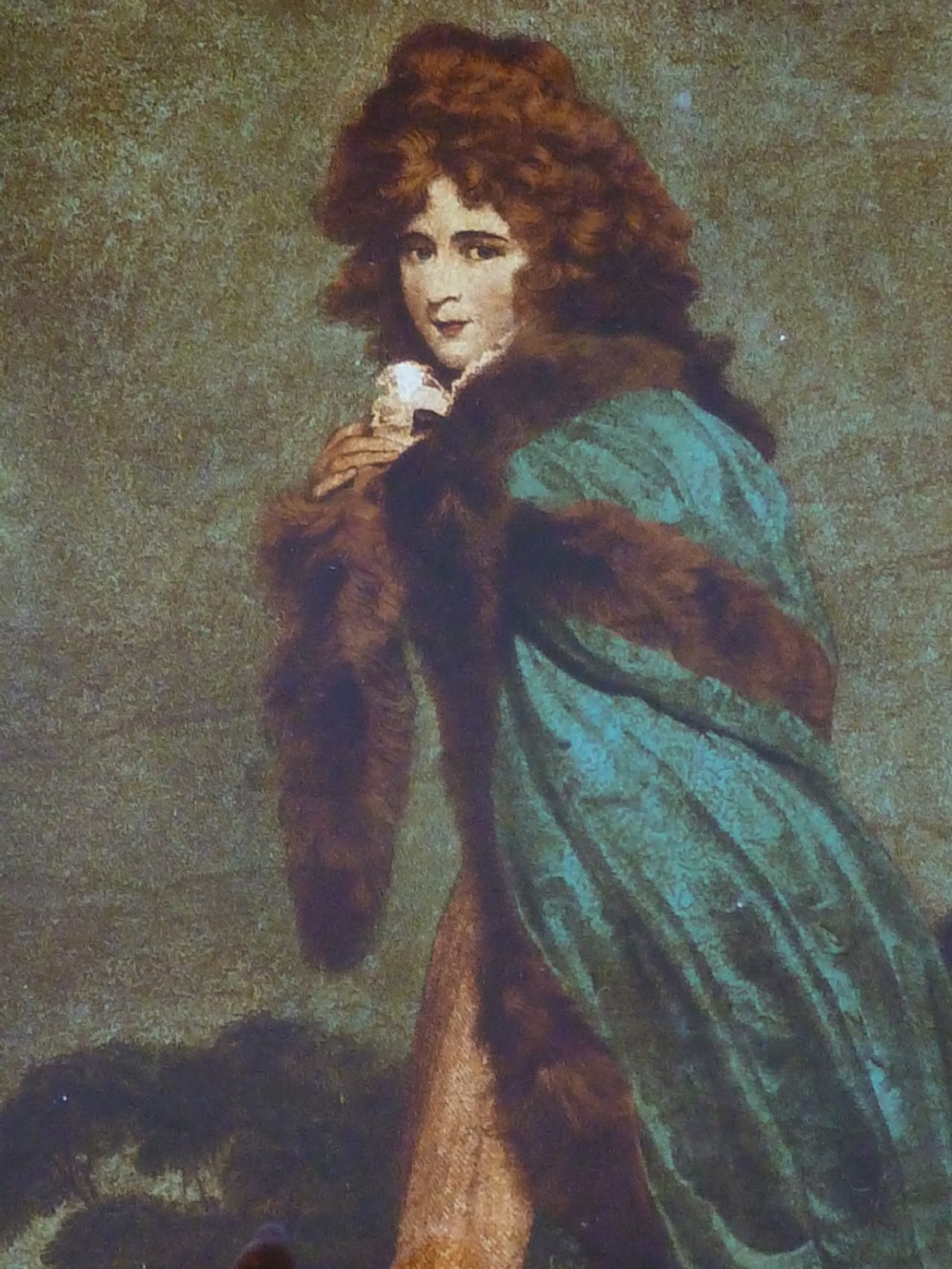A Georgian reverse glass painted print depicting Elizabeth Farren wearing a green fur-trimmed cloak, set in a dark moulded wooden frame with a gilt inner border. View IV