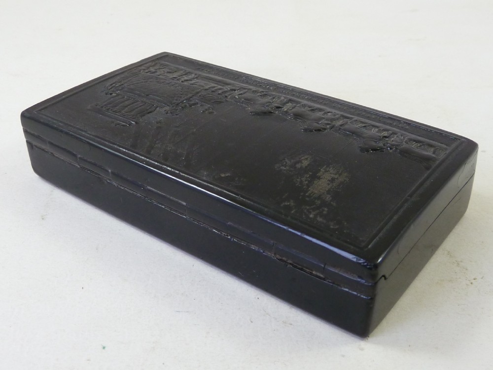 A rectangular dark pressed horn snuff box featuring a relief moulding of Napoleons funeral procession on the lid. View II