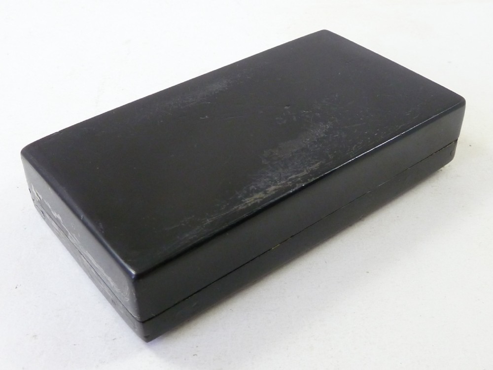 A rectangular dark pressed horn snuff box featuring a relief moulding of Napoleons funeral procession on the lid. View III