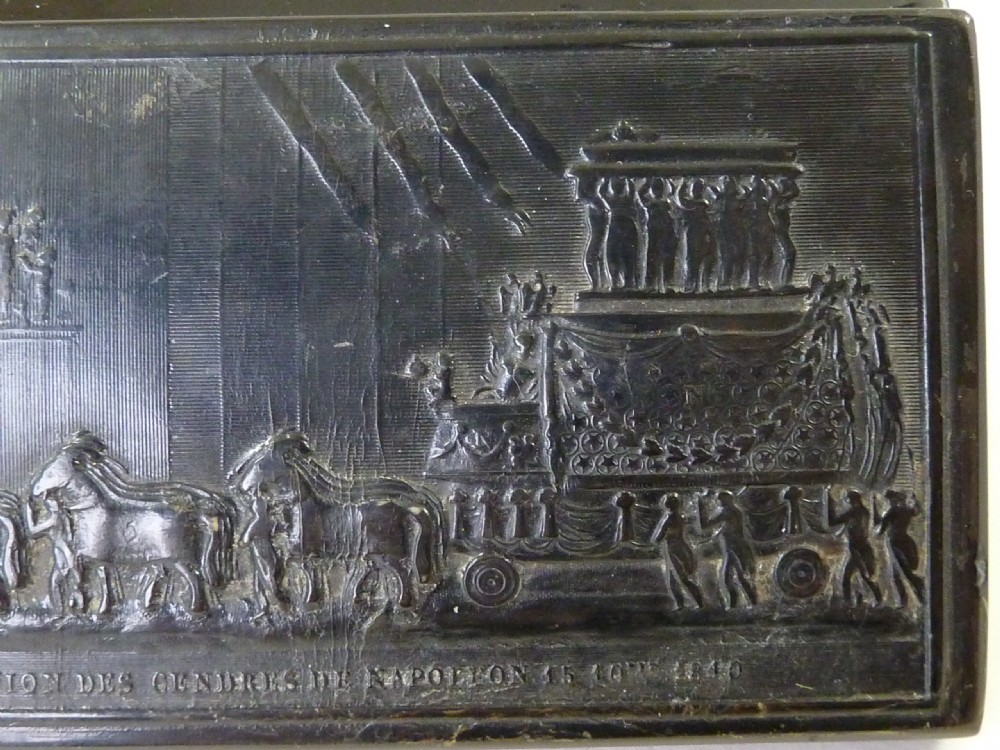 A rectangular dark pressed horn snuff box featuring a relief moulding of Napoleons funeral procession on the lid. View VI
