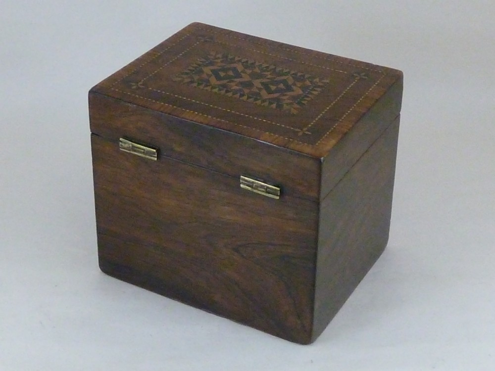 A Victorian rosewood tea caddy featuring intricate geometric wooden mosaic inlay on the lid and front panel. View III