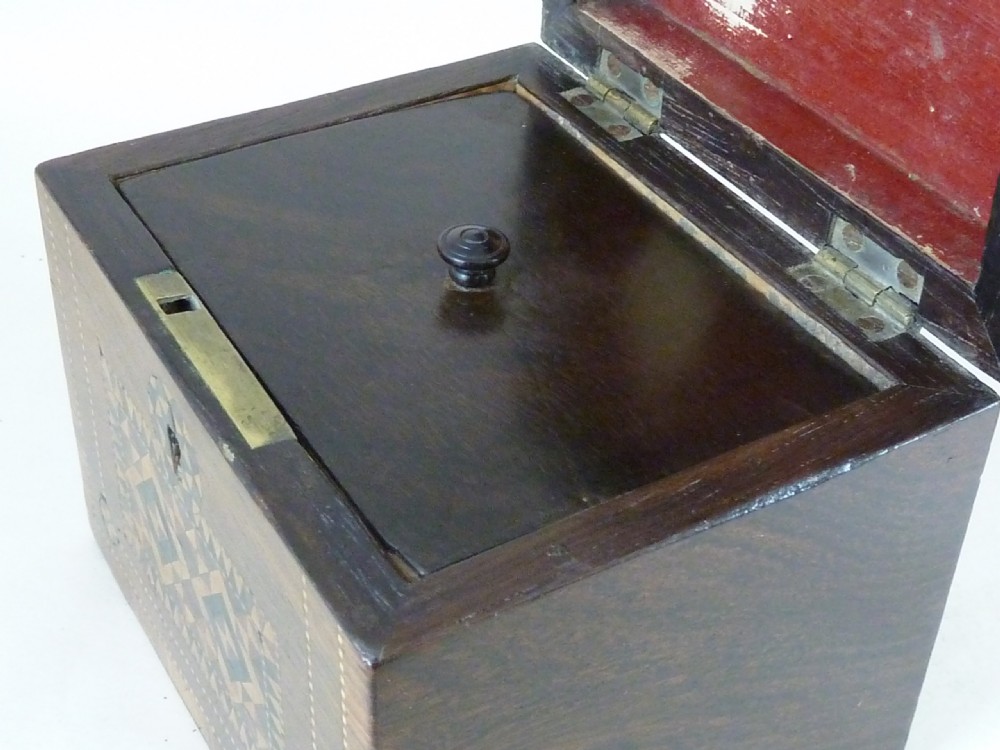 A Victorian rosewood tea caddy featuring intricate geometric wooden mosaic inlay on the lid and front panel. View VIII
