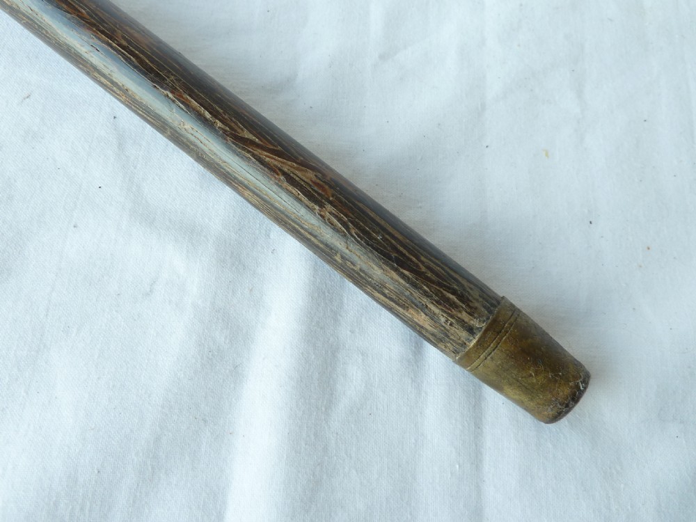 An antique walking stick featuring a round steel ball handle with intricate gold damascene inlay mounted on a dark palm wood shaft. View VIII