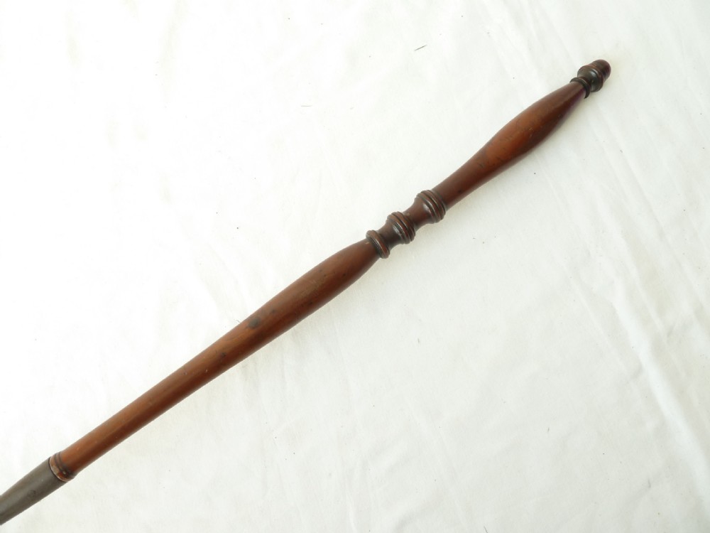 A long Georgian wrought iron toasting fork featuring a three-pronged head and a turned yew wood handle. View V