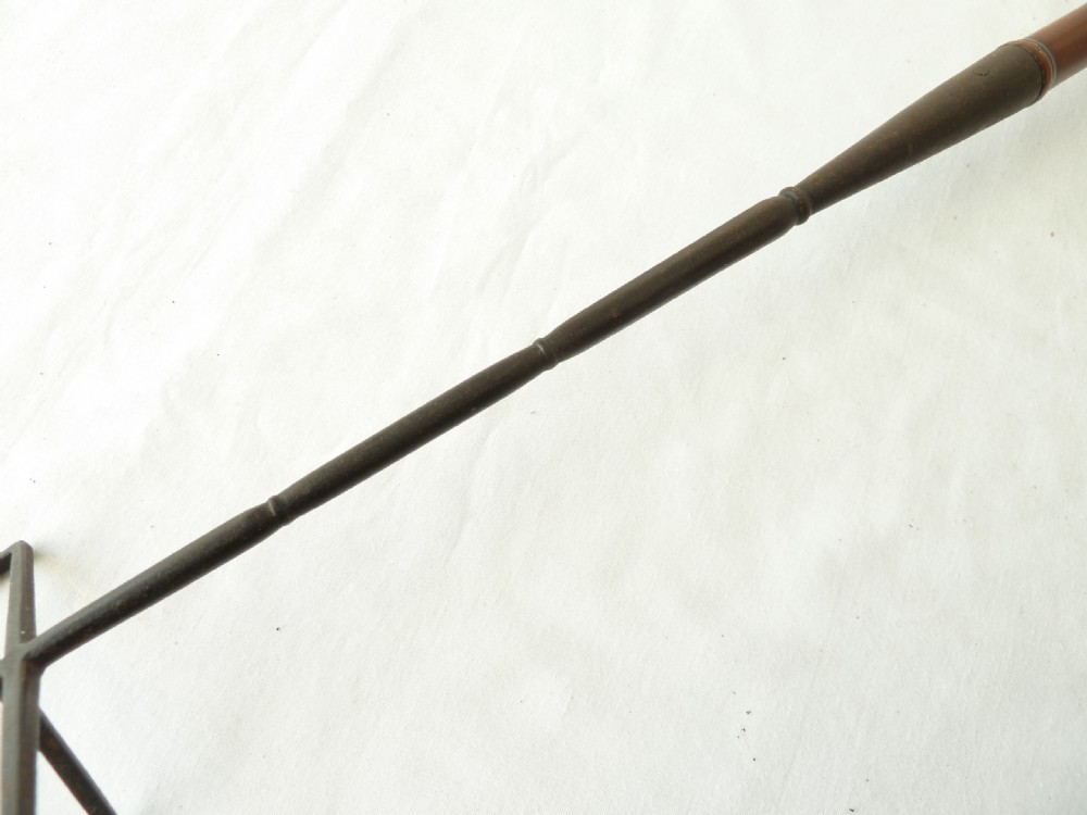 A long Georgian wrought iron toasting fork featuring a three-pronged head and a turned yew wood handle. View VI