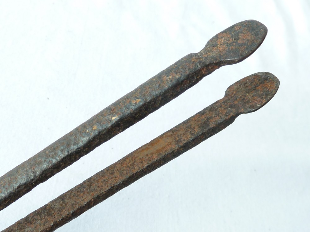 A pair of hand-forged Georgian dark steel ember tongs with elongated jaws and a spring handle mechanism. View VII
