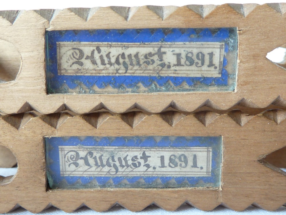A pair of hand-carved Victorian Welsh wooden sugar tongs with serrated edges, heart cutouts, turned knobs, and inset name plates reading Miss Williams. View VIII