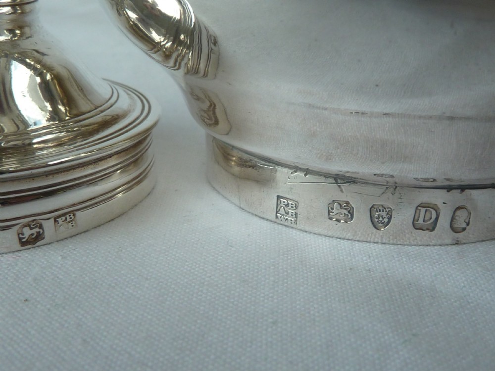 A Georgian sterling silver three-piece wine funnel shown disassembled into a pierced ring, curved spout base, and silver bowl. View II