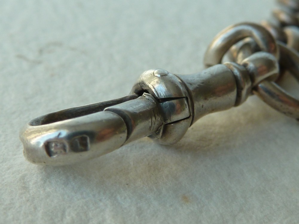 A solid sterling silver Victorian Albert pocket watch chain featuring curb links, a T-bar, swivel clasp, and a heraldic enamelled shield fob. View VIII