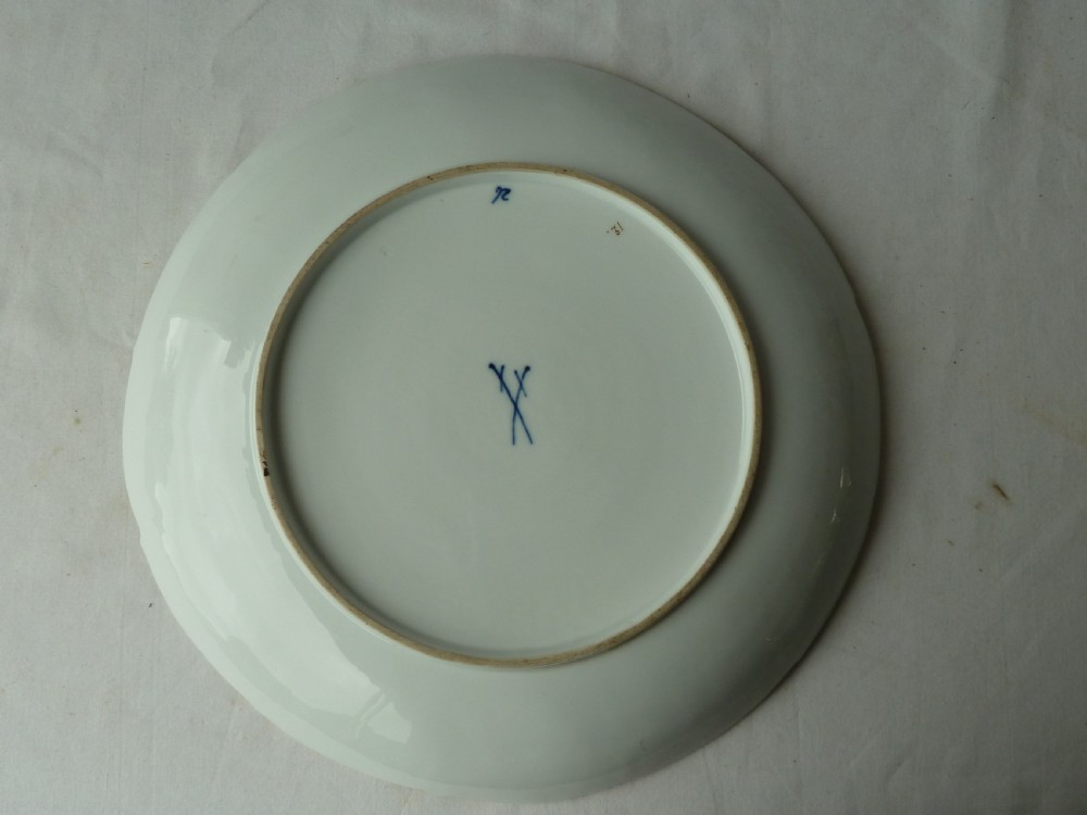 A circular white Meissen porcelain dish featuring a hand-painted illustration of two birds on branches, surrounded by a heavily gilded and pierced Rococo rim. View III