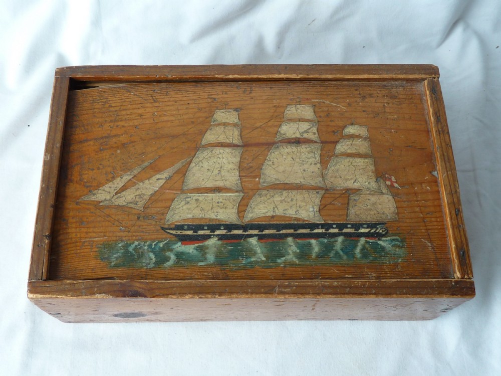 A rectangular wooden sliding-lid box featuring a hand-painted three-masted sailing ship on water against a natural pine background.
