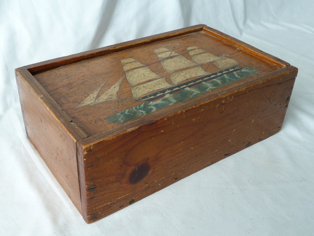 A rectangular wooden sliding-lid box featuring a hand-painted three-masted sailing ship on water against a natural pine background. View II