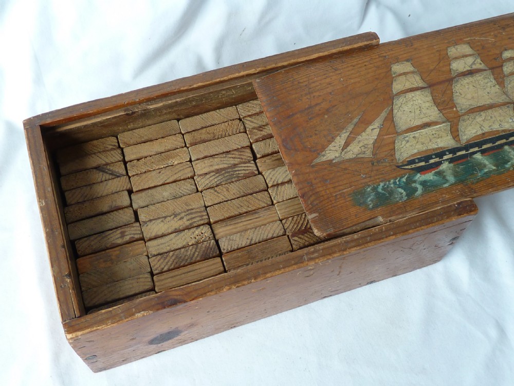 A rectangular wooden sliding-lid box featuring a hand-painted three-masted sailing ship on water against a natural pine background. View III