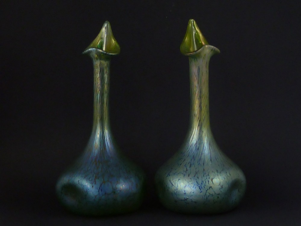 A pair of iridescent green hand-blown glass vases featuring bulbous bases, elongated slender necks, and flared jack-in-the-pulpit rims. View II