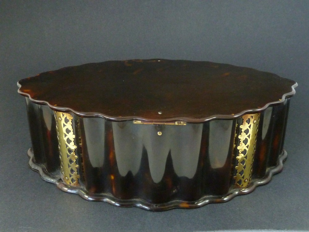 An eighteenth-century lobed Dutch Colonial tortoiseshell casket featuring pierced silver-gilt strapwork mounts and an oval lock plate. View III