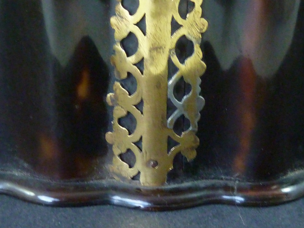An eighteenth-century lobed Dutch Colonial tortoiseshell casket featuring pierced silver-gilt strapwork mounts and an oval lock plate. View IV