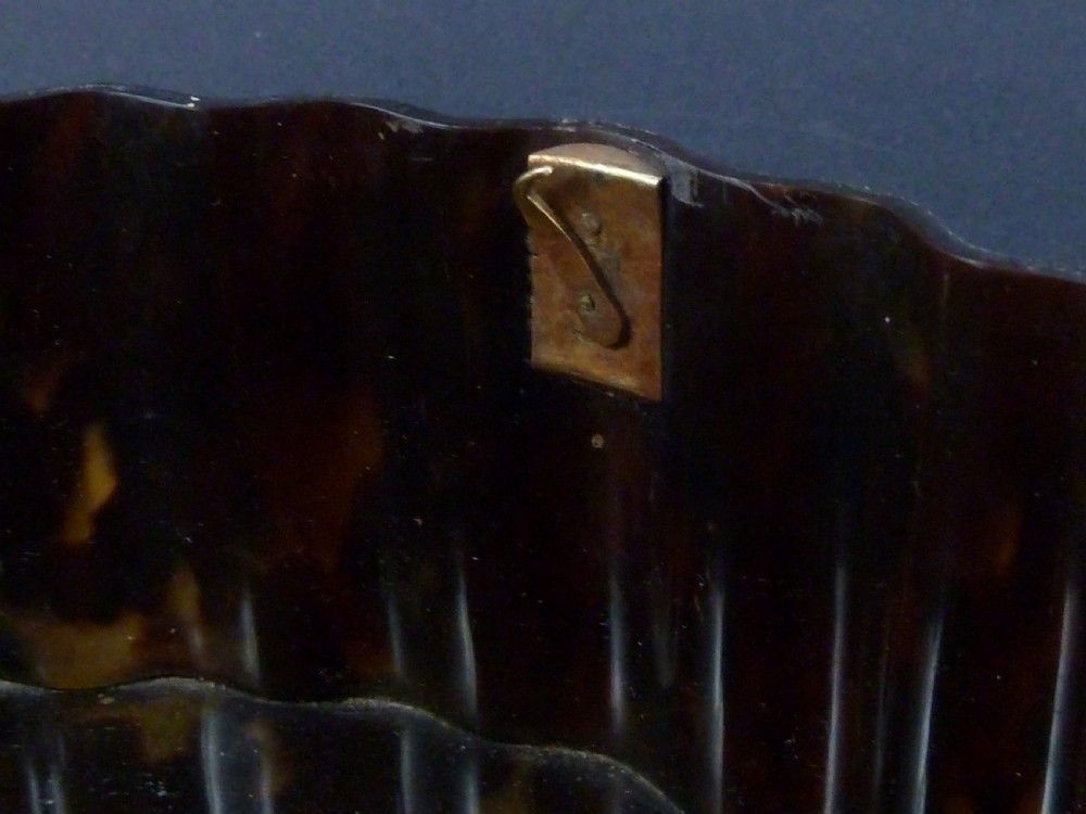 An eighteenth-century lobed Dutch Colonial tortoiseshell casket featuring pierced silver-gilt strapwork mounts and an oval lock plate. View IX