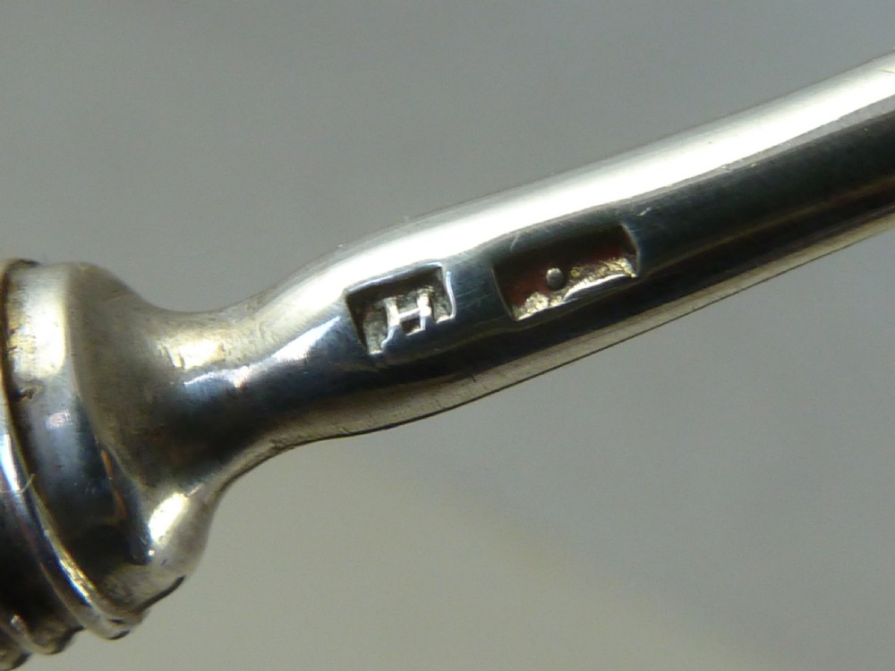 A boxed two-piece Georgian silver fruit knife and fork set with mother-of-pearl handles inside a blue velvet-lined case. View V
