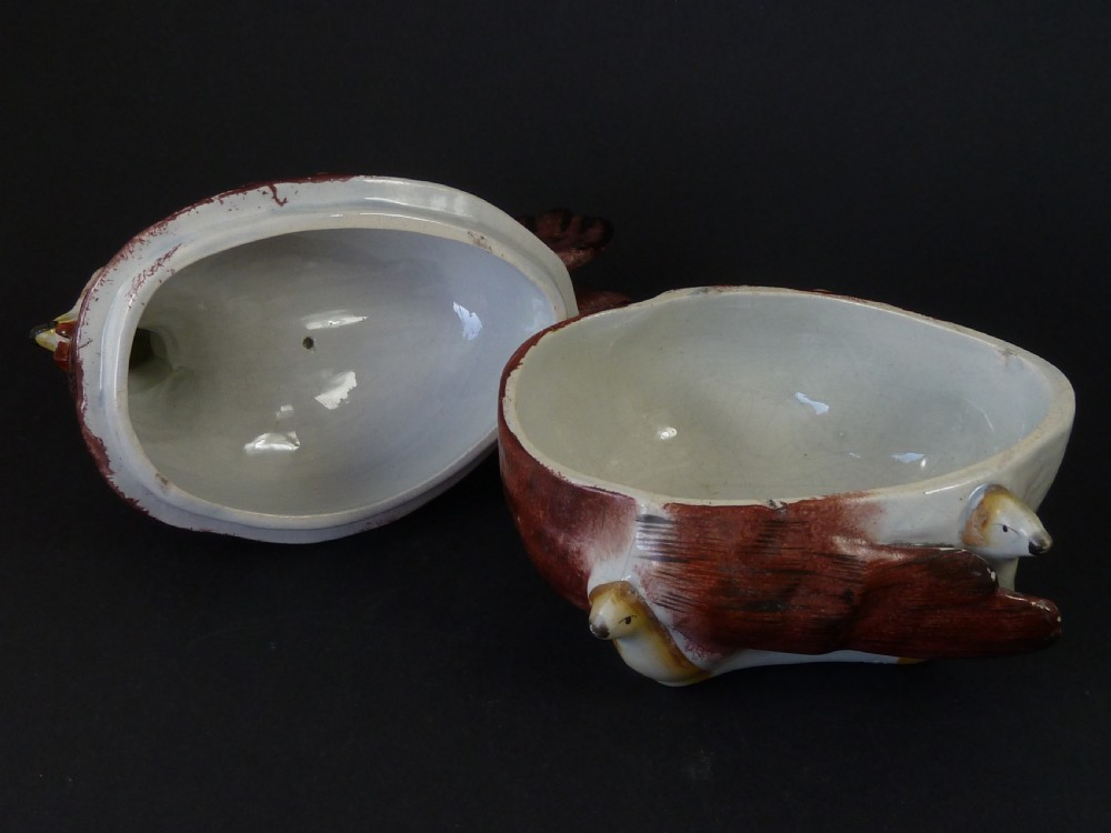 A Victorian glazed earthenware egg tureen shaped like a brown and white hen with small chicks resting along the lid and base. View VII