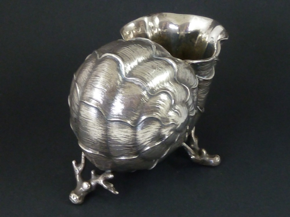 A Victorian electroplated nickel silver spoon warmer styled in the form of a nautilus shell supported by a cast coral branch base. View II