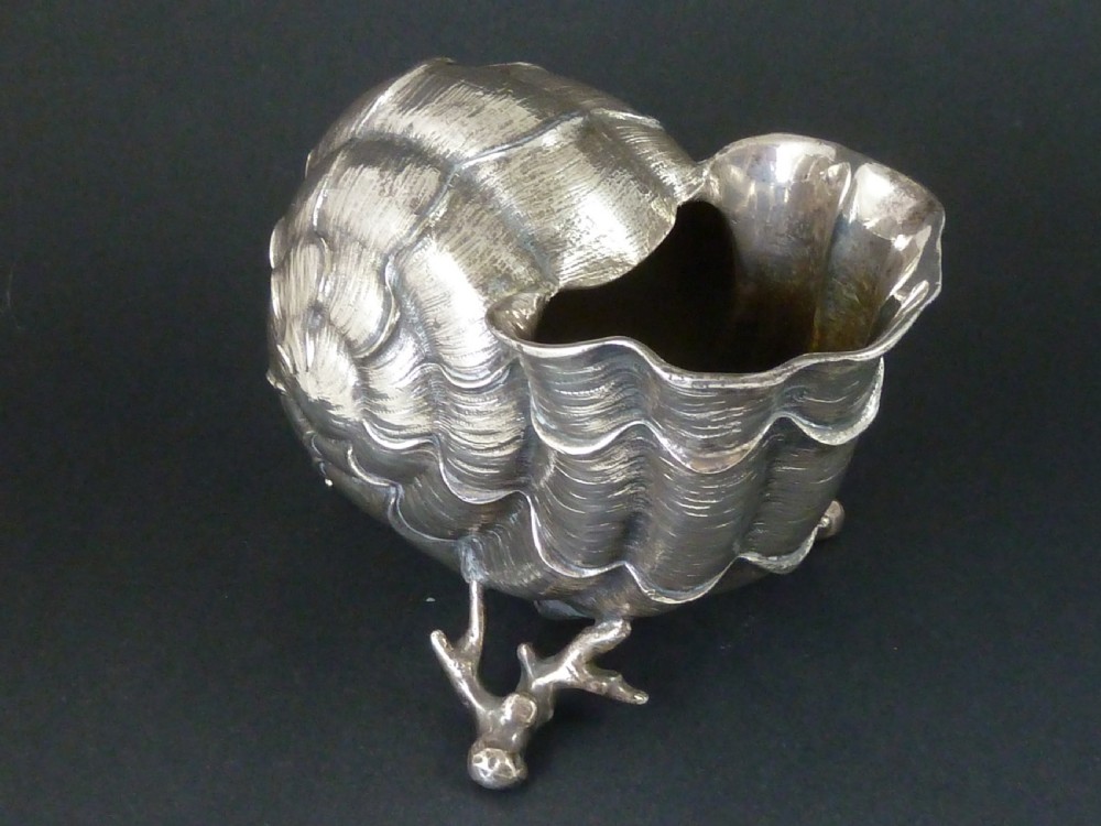 A Victorian electroplated nickel silver spoon warmer styled in the form of a nautilus shell supported by a cast coral branch base. View III