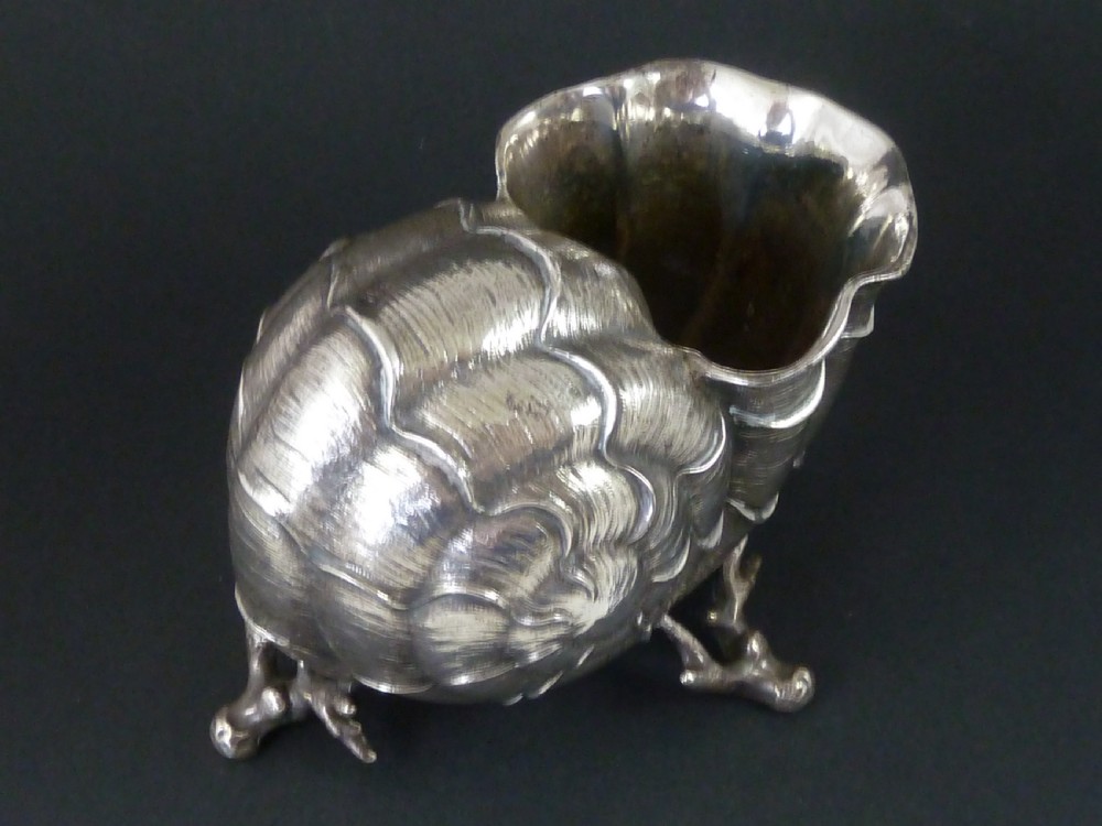 A Victorian electroplated nickel silver spoon warmer styled in the form of a nautilus shell supported by a cast coral branch base. View V