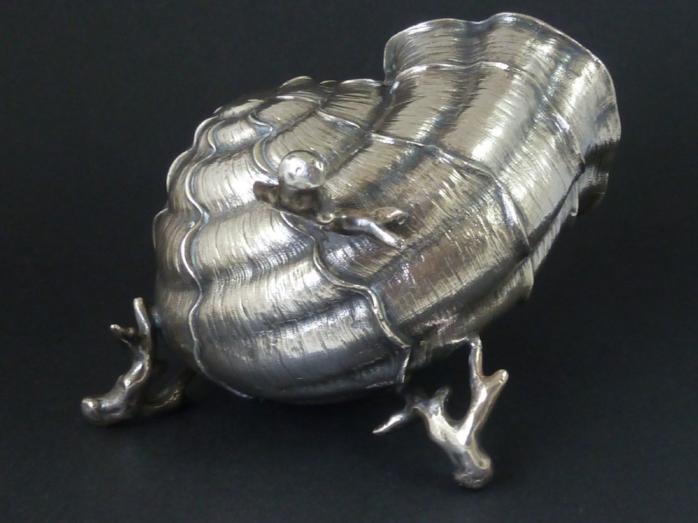 A Victorian electroplated nickel silver spoon warmer styled in the form of a nautilus shell supported by a cast coral branch base. View VI