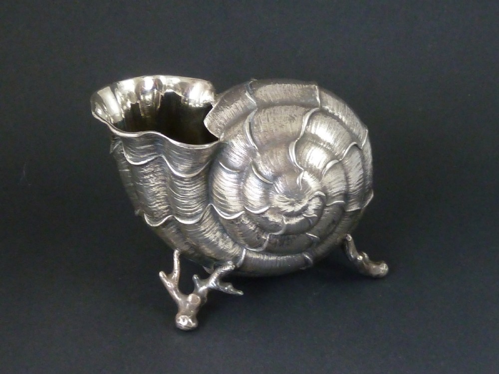 A Victorian electroplated nickel silver spoon warmer styled in the form of a nautilus shell supported by a cast coral branch base. View VIII