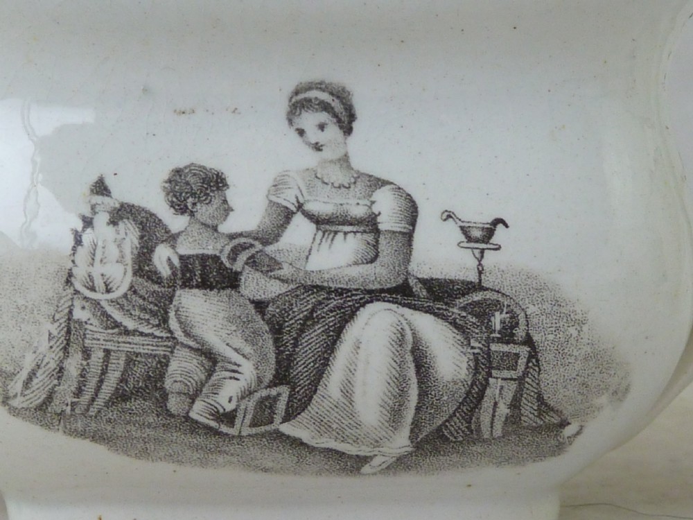 A Georgian era black transfer-printed miniature pearlware tea set featuring a teapot, sugar bowl, milk jug, bowls, cups, and saucers decorated with classical figural scenes. View VII
