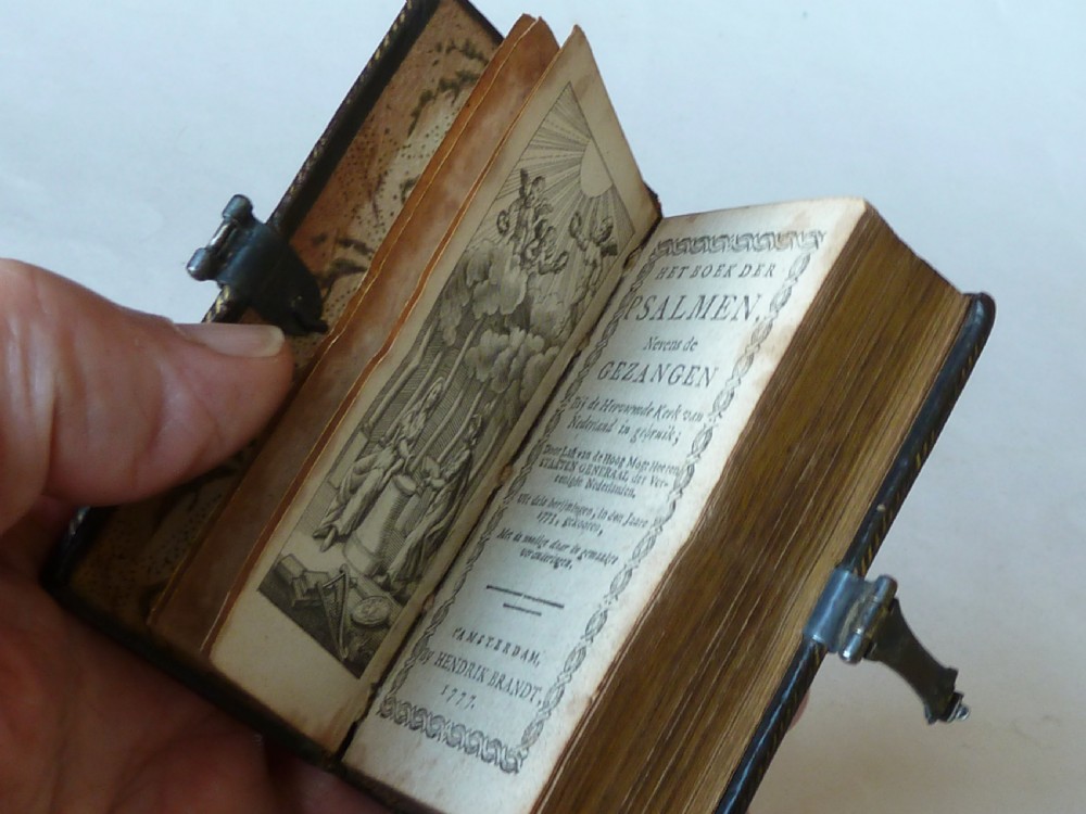 An eighteenth-century miniature Dutch leather-bound psalm book with gilt page edges and a silver metal clasp closure. View II
