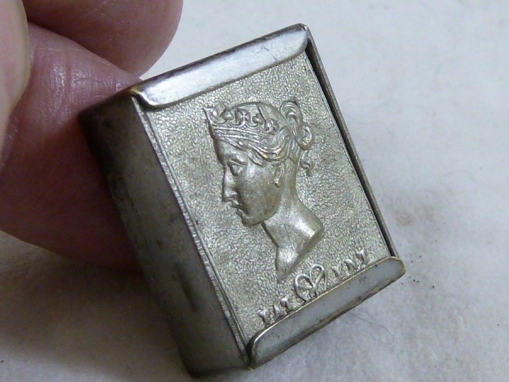 A small rectangular silver-plated stamp box featuring an embossed relief portrait of Queen Victoria in profile on the lid. View VIII